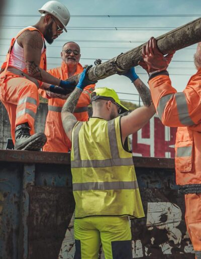 Drummer Mac Pic Dumpster Loading Construction Workers