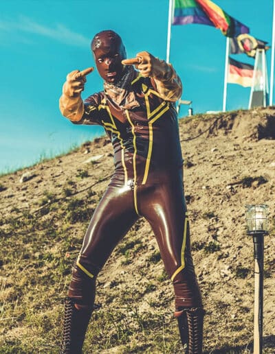 Drummer Man In Rubber Flipping The Finger